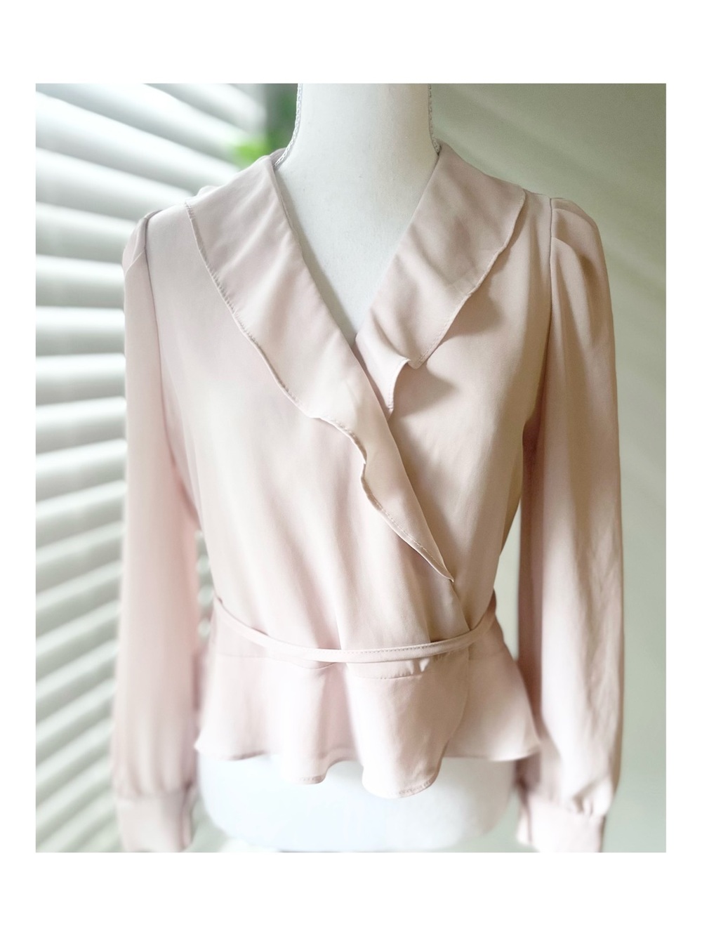 Soft Pink Ruffle Wrap Blouse with Peplum Hem